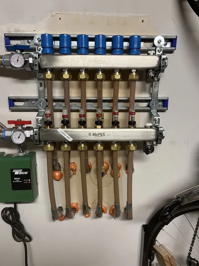 Plumber performing Water Heater Repair at a residential property in Menasha